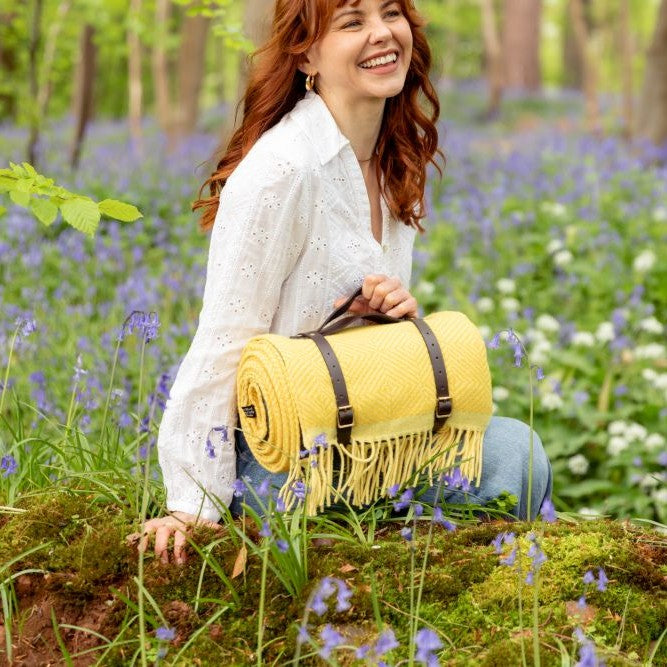 Waterproof Picnic Blanket: Buttercup and Primrose with a waterproof backing and leather carry straps, showcasing a handmade design perfect for outdoor gatherings.