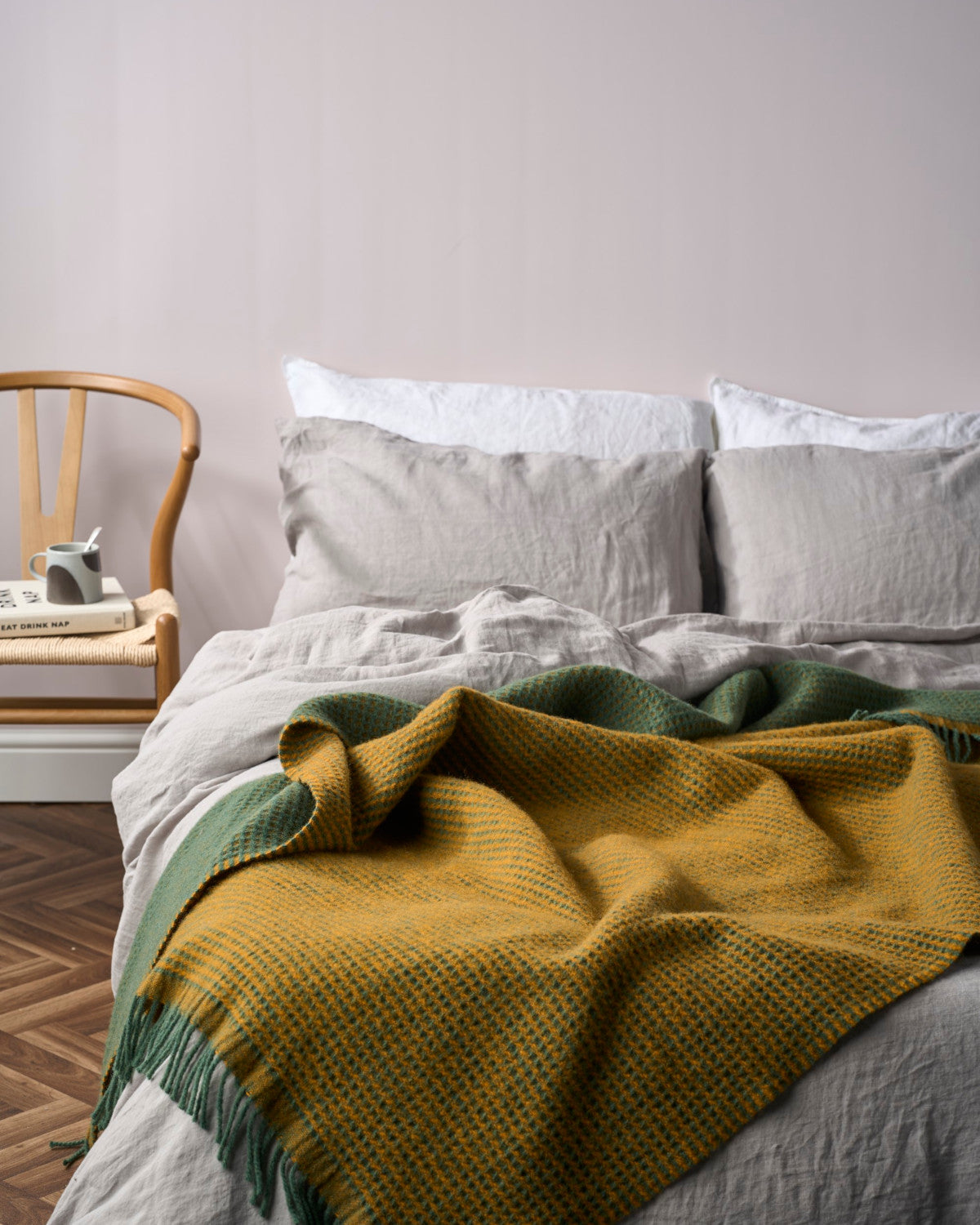 Totterdown Waffle Blanket: College Green & Ashton, highlighting its textured waffle weave, crafted from pure wool, offering warmth and style in a vintage-inspired design.