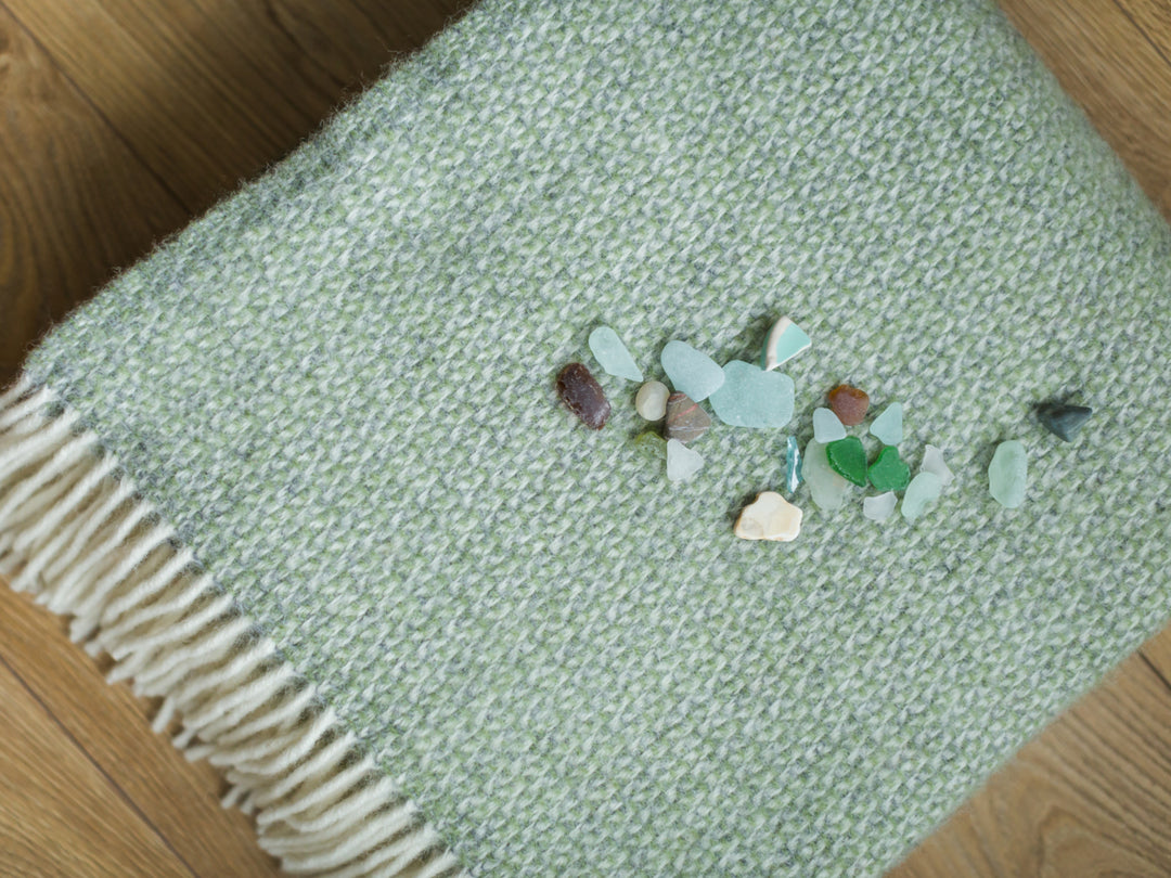 green and grey wool throw with sea glass from the british blanket company