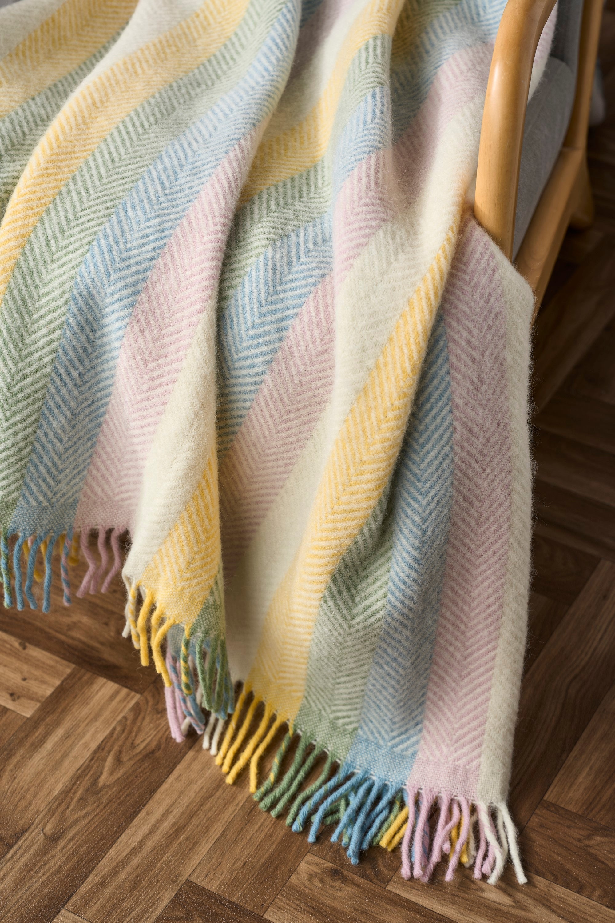 Detail image of pastel rainbow stripe blanket