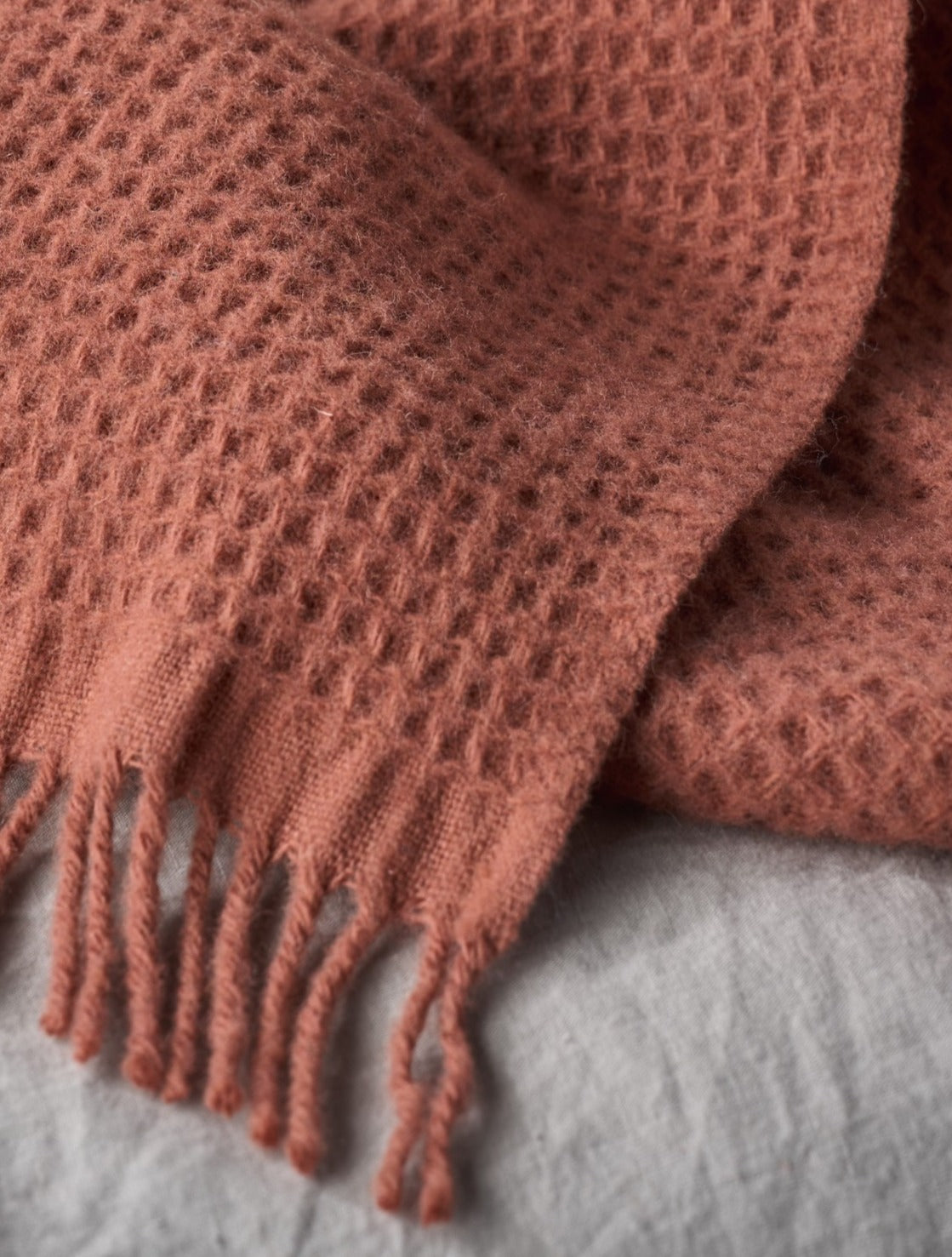 Detail image of terracotta waffle blanket