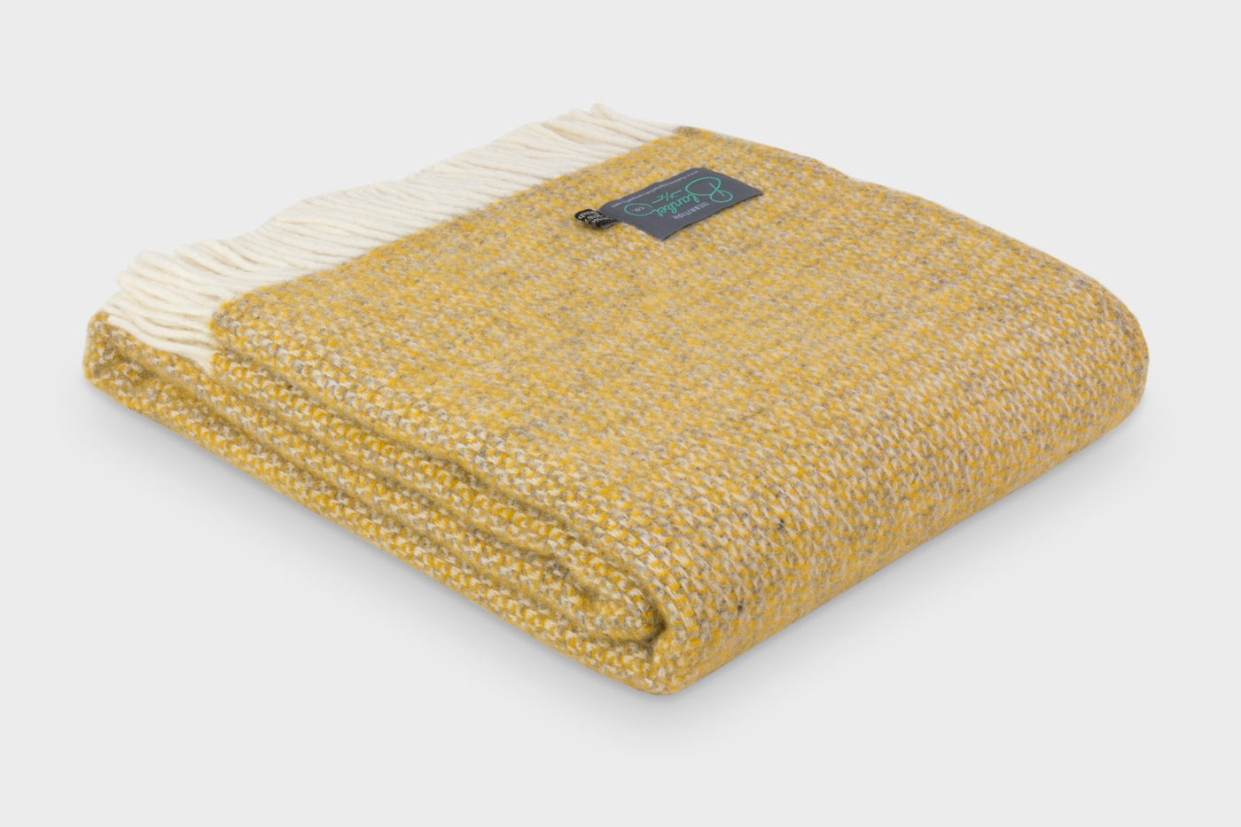 Folded large yellow and grey windmill wool throw by The British Blanket Company