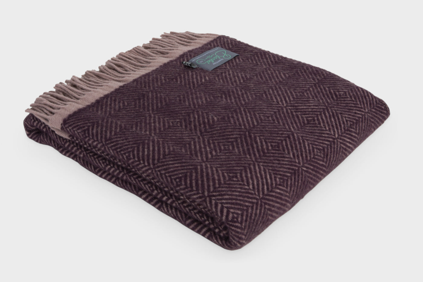 Folded purple wildweave wool throw by The British Blanket Company