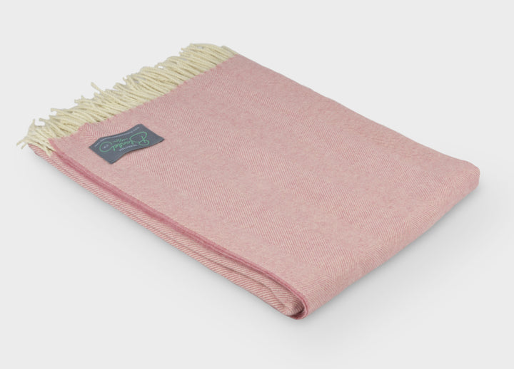 Folded XL pink merino herringbone wool throw by The British Blanket Company