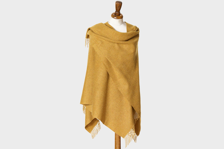 Wearable gold wool blanket wrap by The British Blanket Company.
