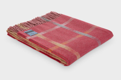 Folded red merino lambswool throw from the Garden Flowers collection by The British Blanket Company