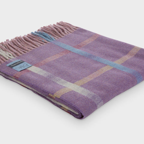 Folded purple merino lambswool throw from the Garden Flowers collection by The British Blanket Company