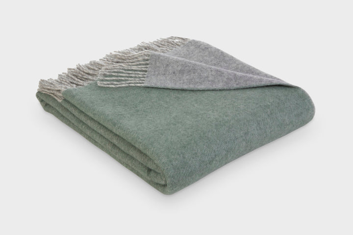 Folded green and grey reversible wool throw blanket by The British Blanket Company