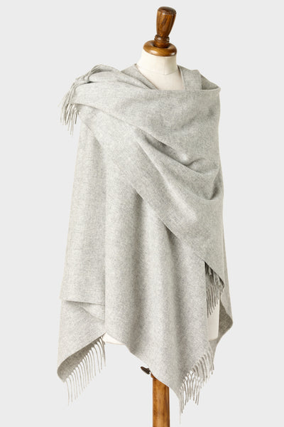 Light grey wearable lambswool blanket wrap on a mannequin