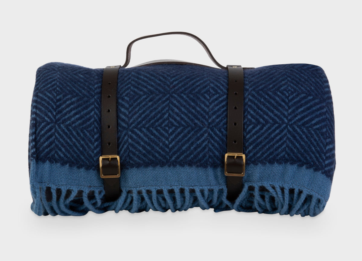 Blue wool picnic blanket with leather straps from The British Blanket Company