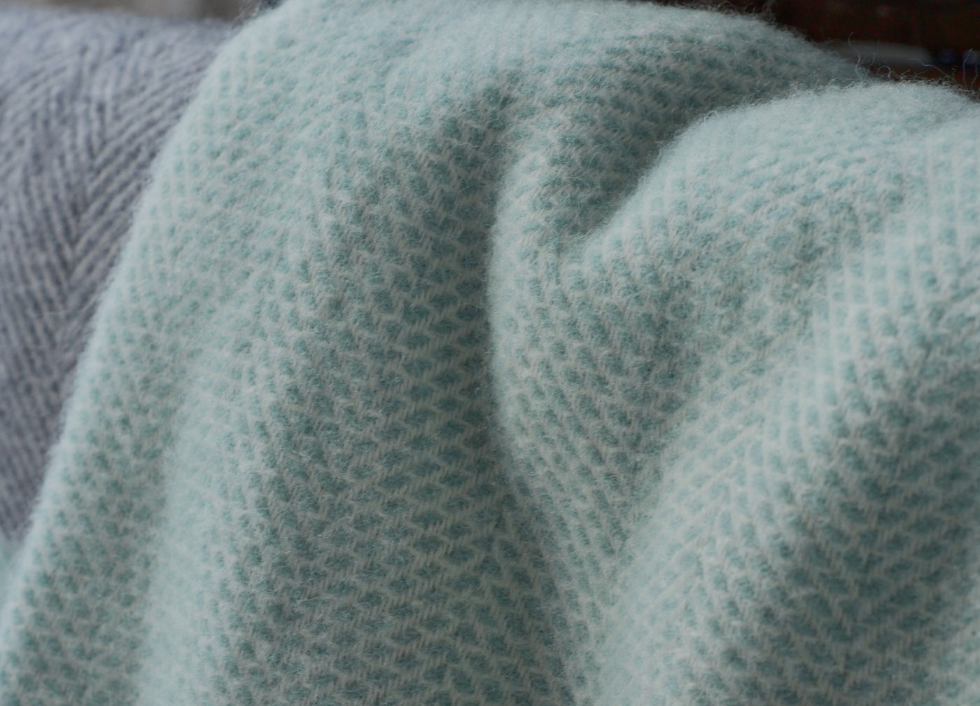 Closeup of a large green beehive wool blanket