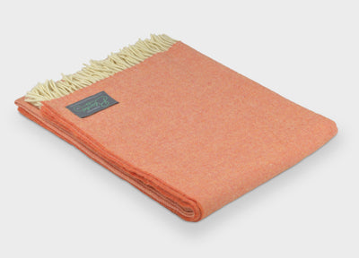 Orange merino herringbone wool throw by The British Blanket Company.