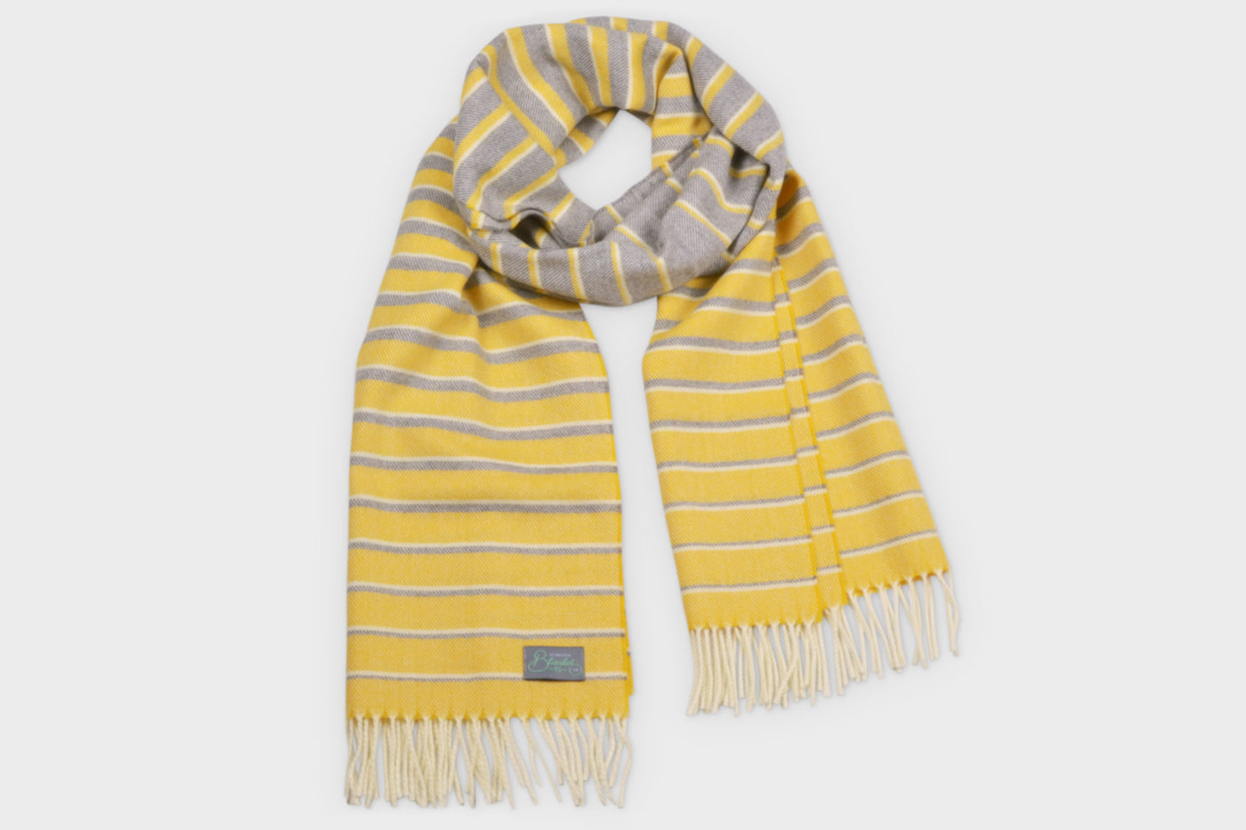 A yellow and grey oversized blanket scarf by The British Blanket Company