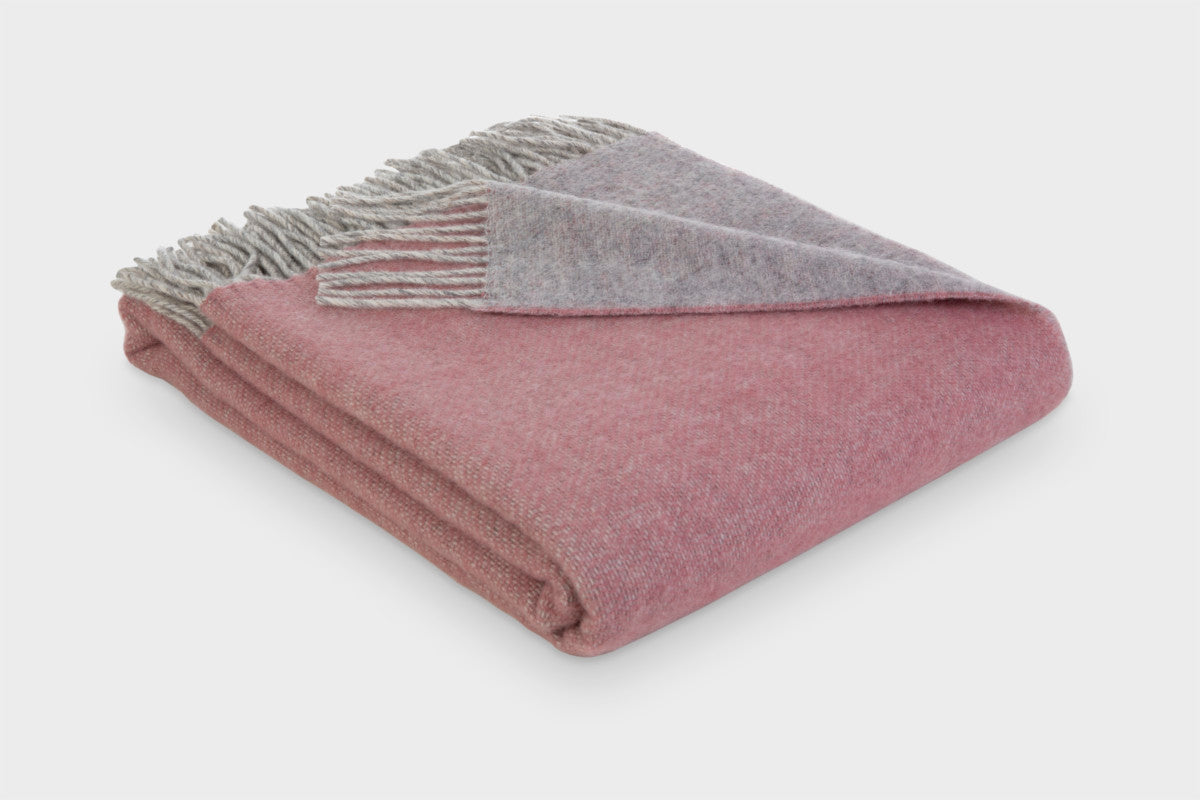 Folded pink and grey reversible wool throw blanket by The British Blanket Company