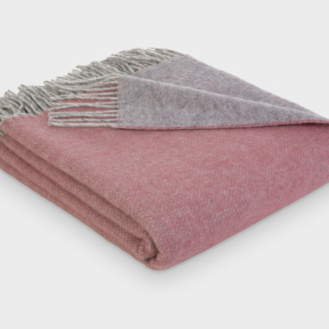 Folded pink and grey reversible wool throw blanket by The British Blanket Company
