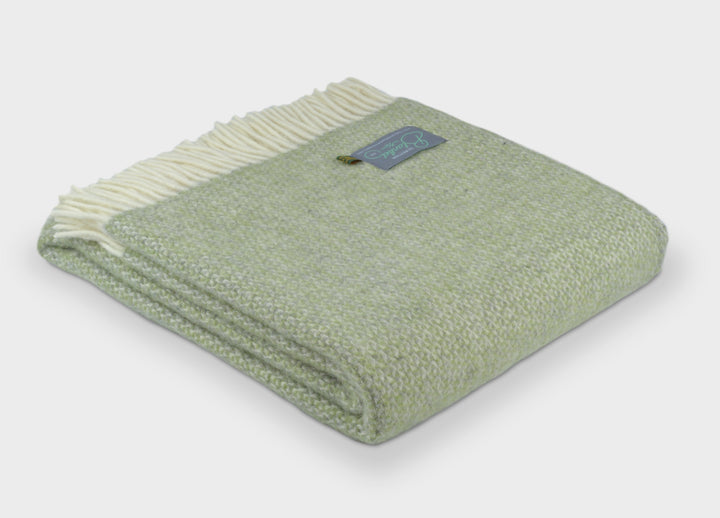 Folded green and grey windmill wool throw by The British Blanket Company