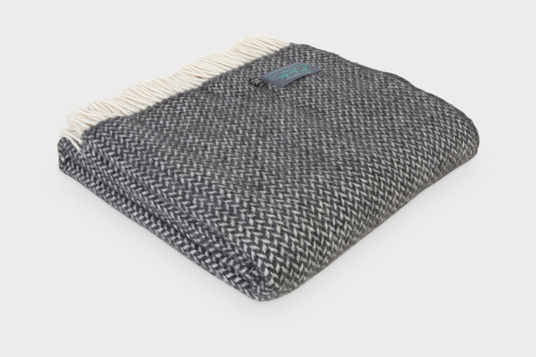 Folded extra large grey herringbone wool throw by The British Blanket Company