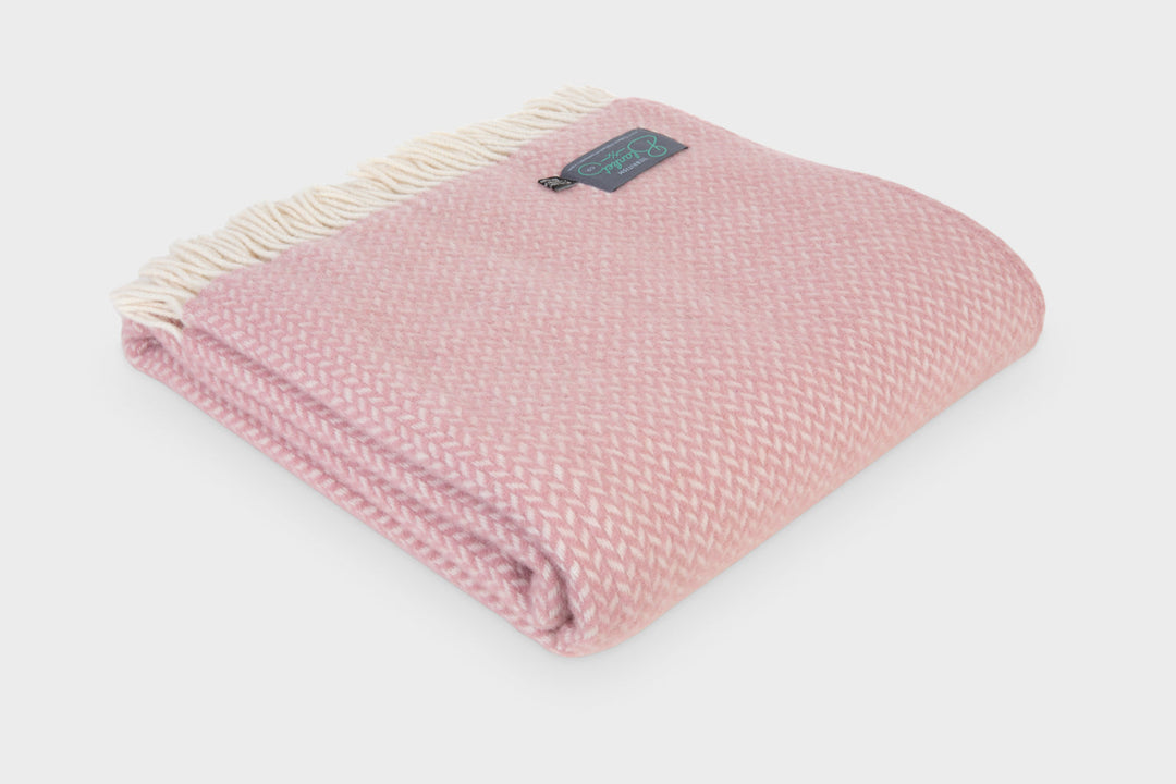 Folded XL dusky pink herringbone wool throw by The British Blanket Company