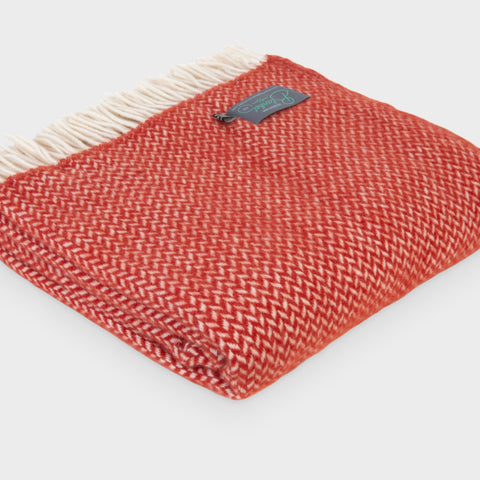 Folded large red herringbone wool throw by The British Blanket Company