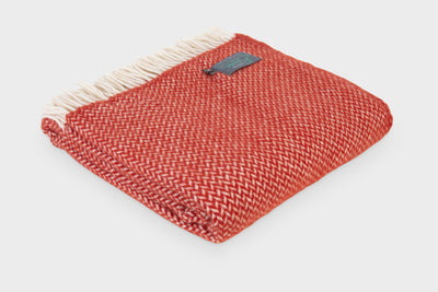 Folded XL red herringbone wool throw by The British Blanket Company