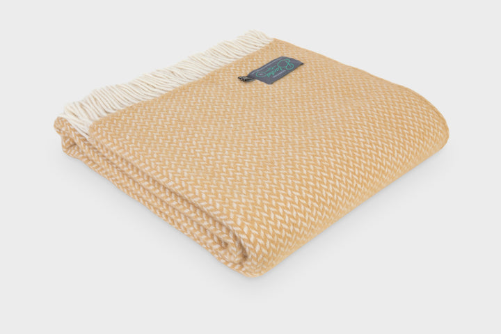 Folded large toffee herringbone wool throw by The British Blanket Company