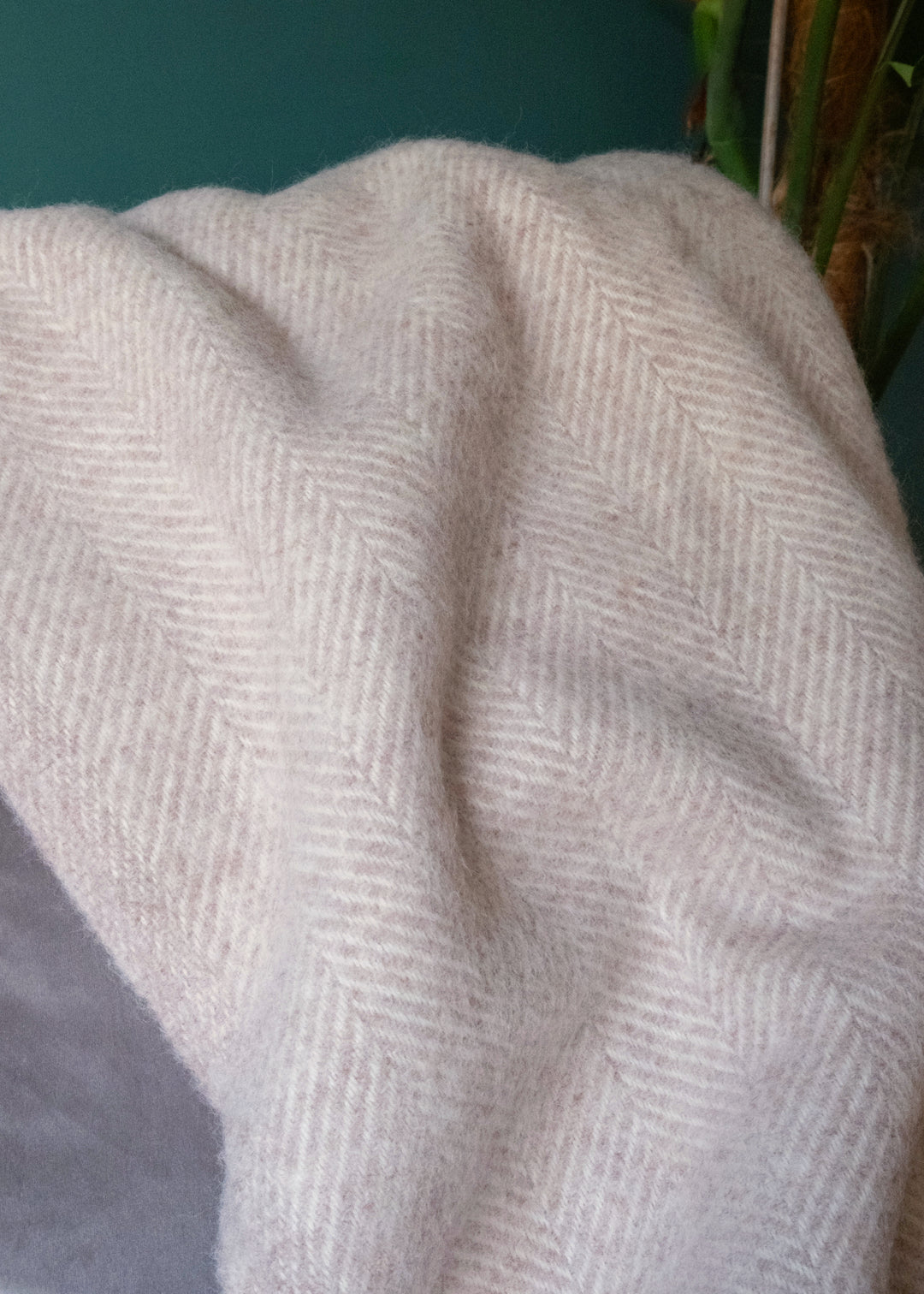 close up of beige herringbone throw blanket