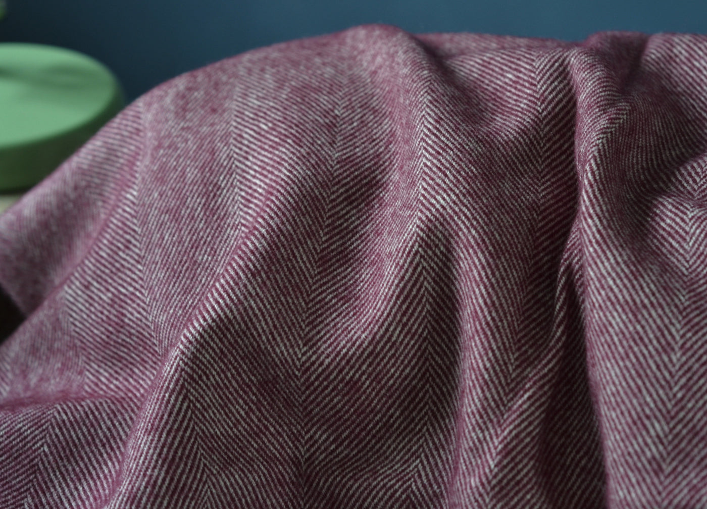 Closeup of large purple merino herringbone wool blanket.