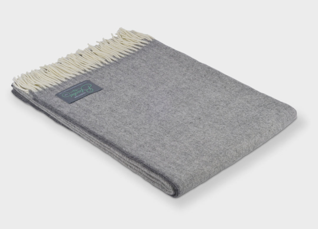 Folded XL grey merino herringbone wool throw by The British Blanket Company