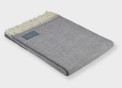 Folded grey merino herringbone wool throw by The British Blanket Company 