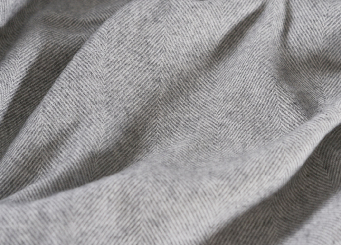 Closeup of XL grey merino herringbone wool blanket