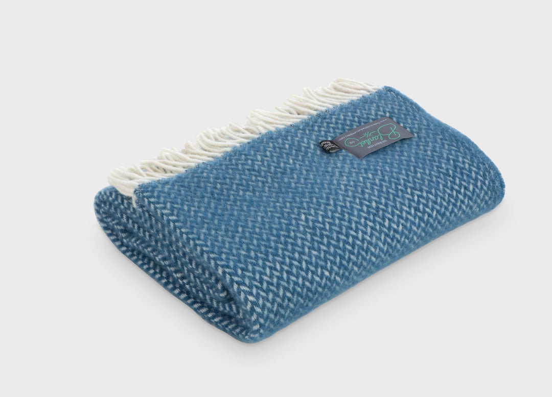 Blue herringbone wool throw by The British Blanket Company