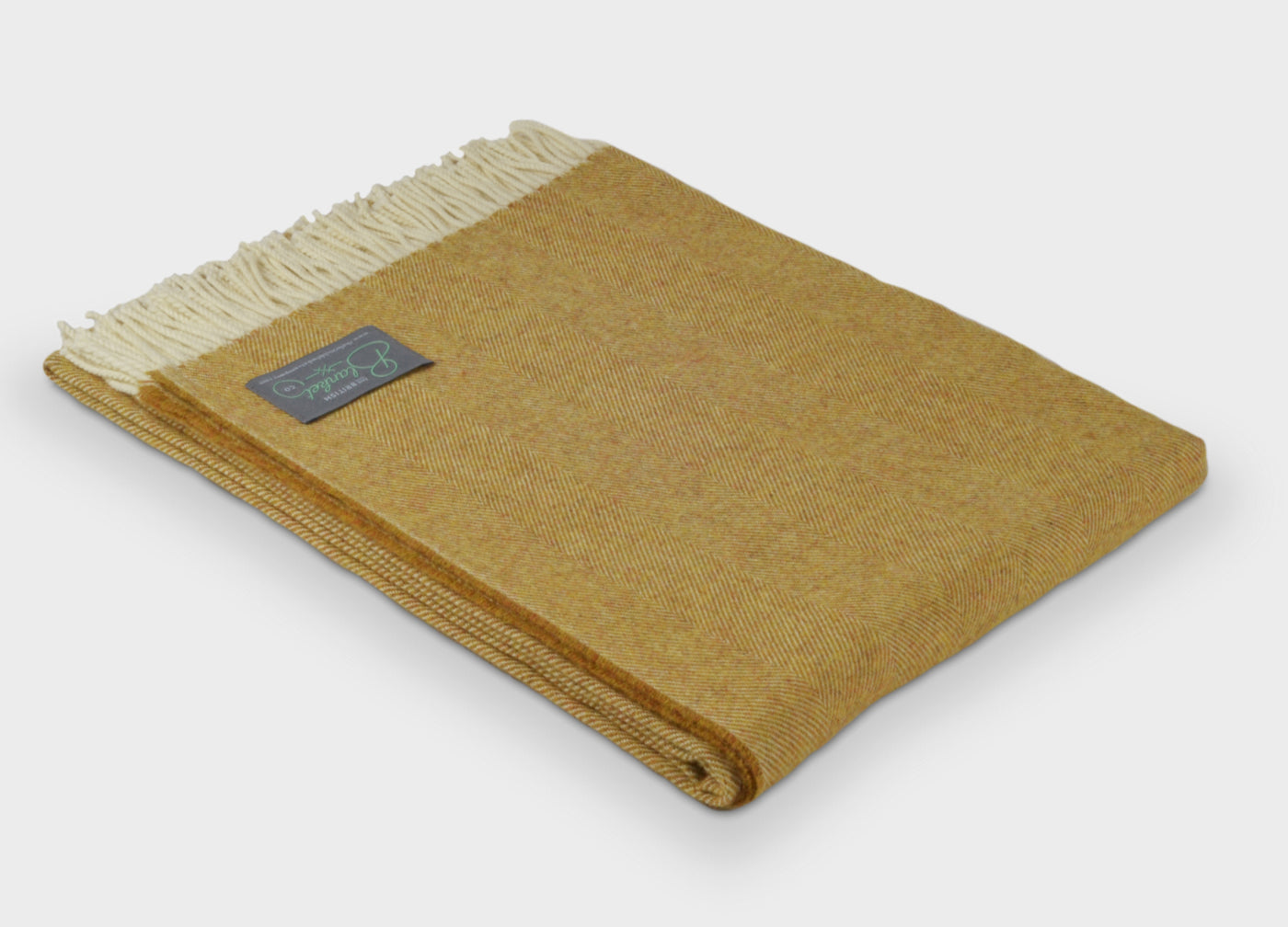 Folded XL yellow merino herringbone wool throw by The British Blanket Company