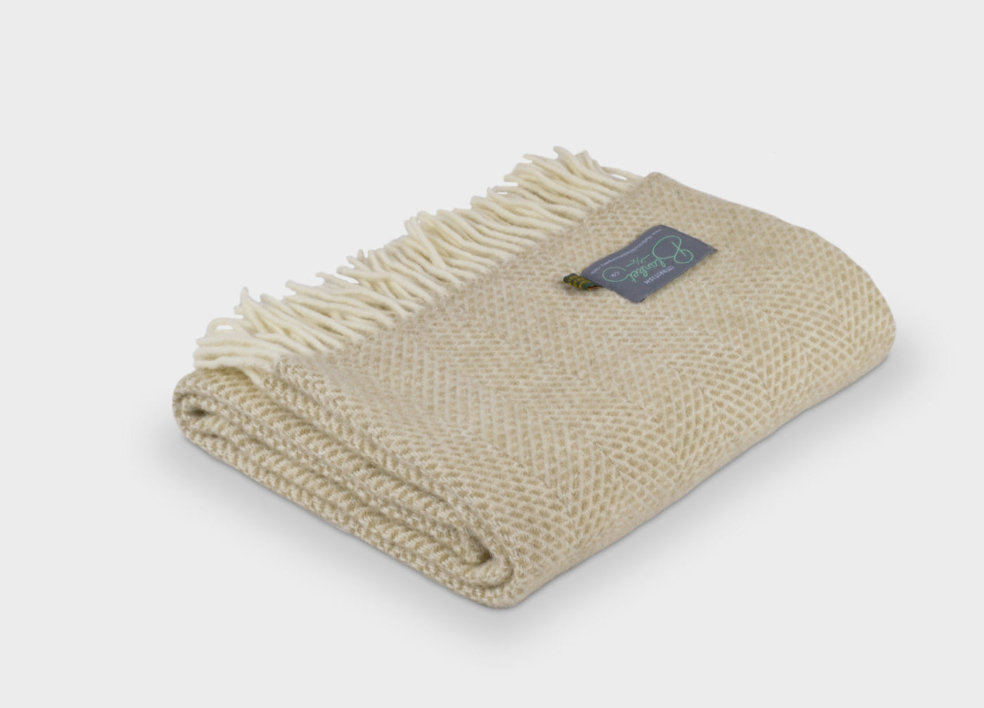 Folded beige beehive wool throw by The British Blanket Company