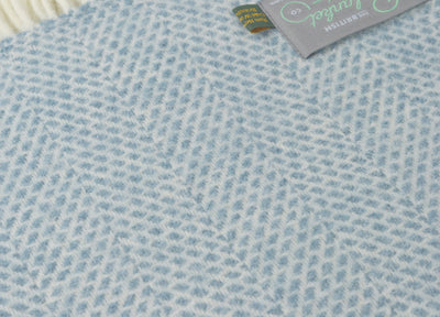 Closeup of a blue beehive wool throw by The British Blanket Company