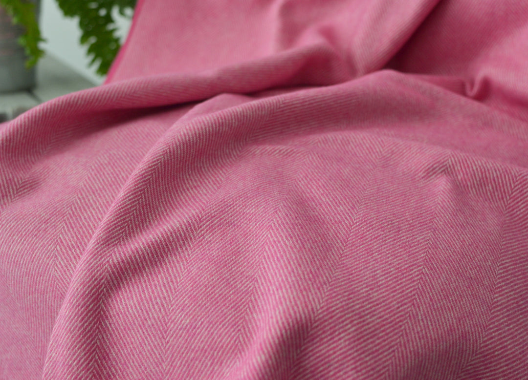 Closeup of large pink merino herringbone wool blanket