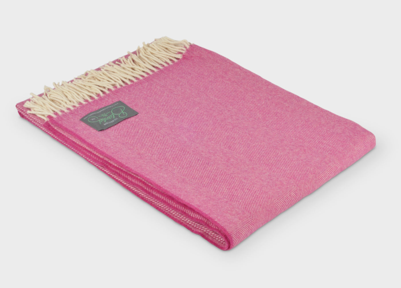Folded large pink merino herringbone wool throw by The British Blanket Company