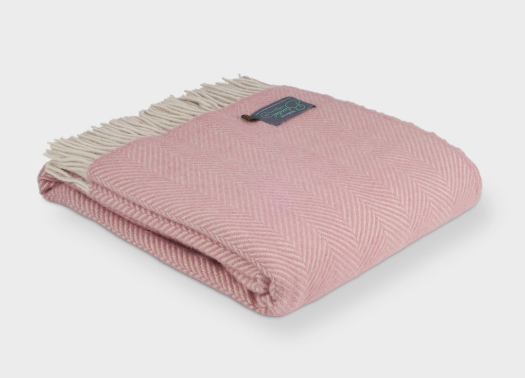 Folded XL pink herringbone wool throw by The British Blanket Company