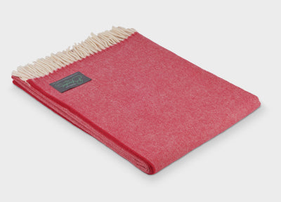 Folded red merino herringbone wool throw by The British Blanket Company