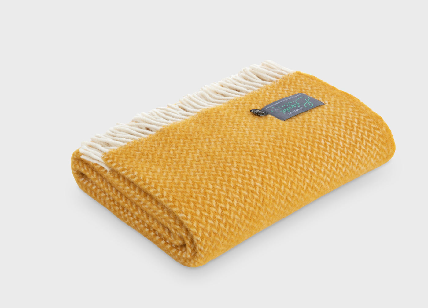 Folded yellow herringbone wool throw by The British Blanket Company